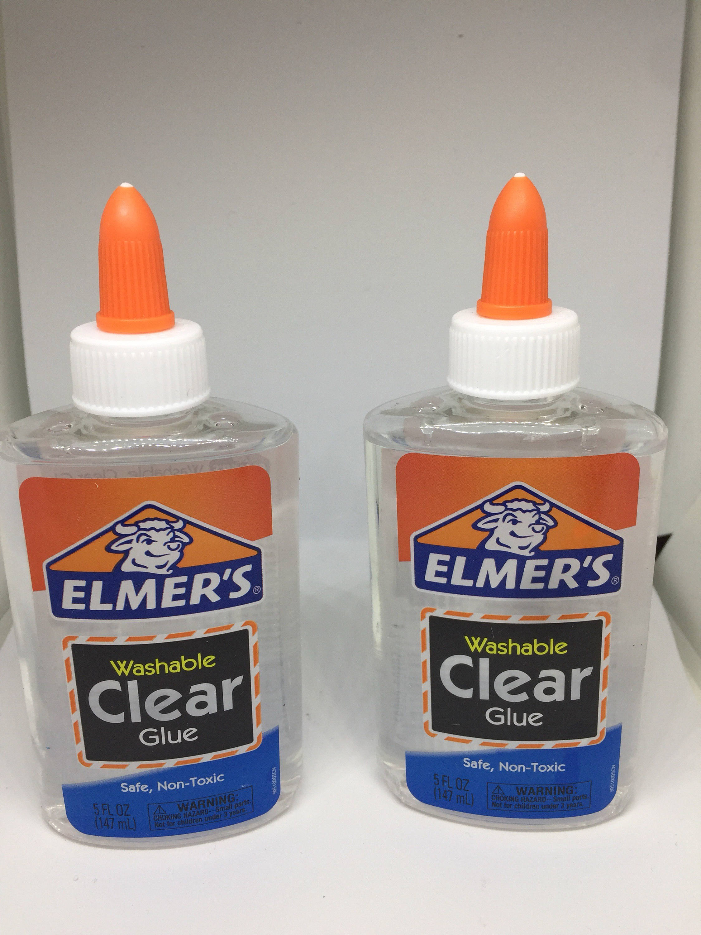 Clear glue brings two bottles