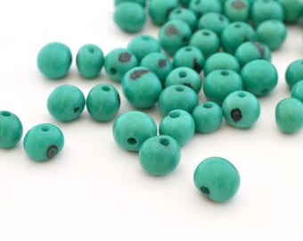 10 emerald green round 6-10mm Acai seeds beads