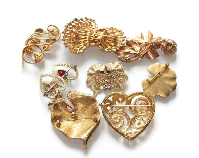 Eight Brooch Lot Gold Tone Hearts Corocraft Scitarelli MOP Floral Mid Century Jewelry