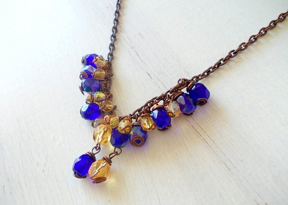 Blue and yellow necklace with glass beads burnished chain
