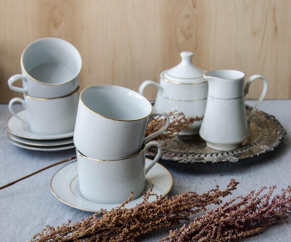 Vintage ceramic mug. Vintage porcelain. All white with golden trims