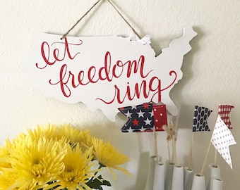 America cut-out sign: Let Freedom Ring