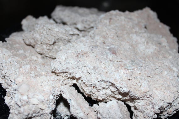 Raw white crumbly clay dirt chunks. Clean and edible clay dirt