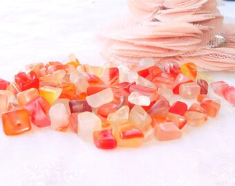 transparent red, orange stone nugget is 87 stones