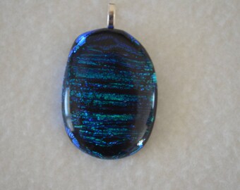 Glass pendant with green and blue lines