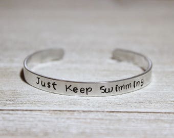 JUST KEEP SWIMMING Cuff Bracelet - Disney Finding Nemo Fan Gift - Stamped Metal Bangle - Dory - One Size Fits All - Made in the U.S.A.