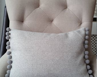 Handmade grey herringbone wool cushion cover with grey pom poms