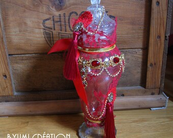Old red and gold liquor decanter