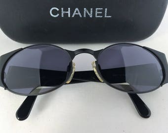 Chanel Authentic vintage black oval sunglasses, circa 1995, adjustable nose pads