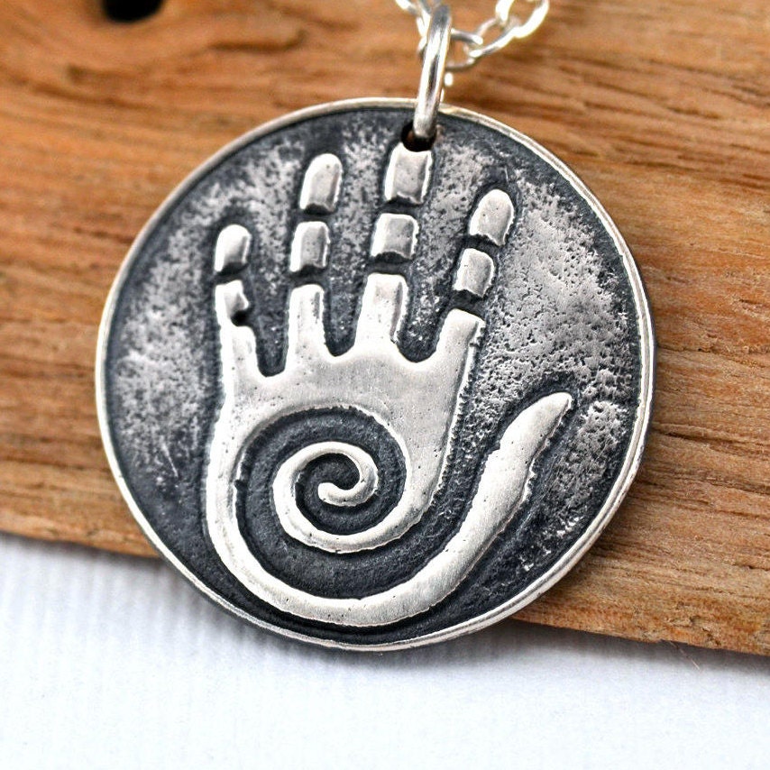 A Native American Style Spiral Healing Hand Shaman Pendant