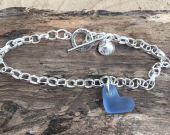 Sea Glass Carved heart in cornflower blue with sterling silver fancy catch bracelet and clam shell