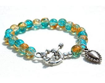 Bracelet jewelry glass and sterling silver charm, turquoise and honey