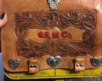 Leather purse, hand carved