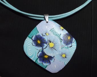 Turquoise necklace and blue sky on a leather cord.