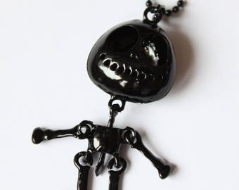 Black necklace with articulated snowman pendant