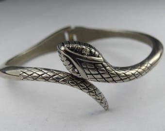 Gorgeous chrome 1980s snake bangle with crystal eyes