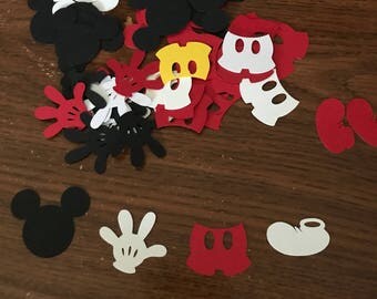 Mickey Mouse confetti . Mickey Mouse birthday party. Mickey Mouse shoes, Mickey Mouse pants, Mickey Mouse hands, and Mickey Mouse heads.