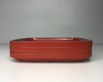 set of three 6-inch stackable retro Rosti Denmark Falle Uldall melamine plates in rust red