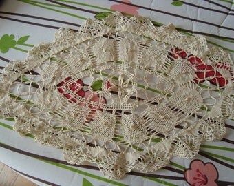 the spindle in antique linen doily
