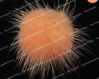 Salmon colored mink fur ball