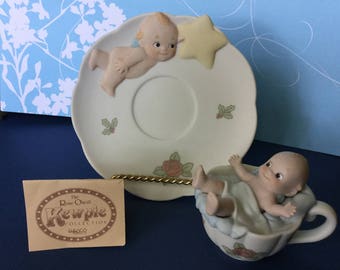 Rose O'Neill Kewpie 1994 Enesco Jesco Bisque Kewpie in Cup with Saucer Kewpie holding a Star