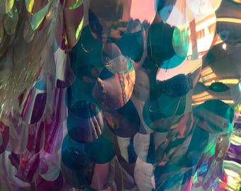 NEW iridescent jumbo size tear drop sequins on stretch mesh base 2 way stretch 56/57" Sold by the YD. Ships worldwide from Los Angeles CA