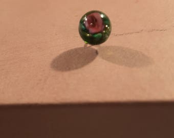 Small glass paperweight button of a rose.