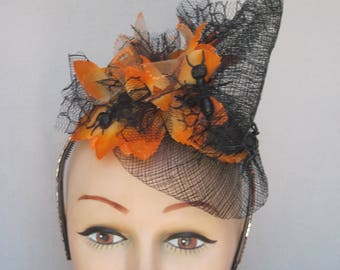 Spooky Black Open Woven Scarecrow Hat with Crawling Black Ants on Orange Flowers on an Orange Crystal Hat Band