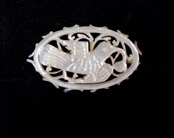Vintage carved mother of pearl brooch