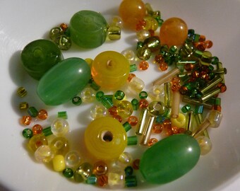 Set of beads, green, orange, yellow mixed - shapes and sizes vary