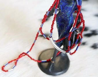 Red and purple seed beads necklace with curved metal bead feasibility of measurement