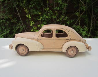Wooden miniature of a Peugeot 203 pyracantha/Maple 1/24 scale.