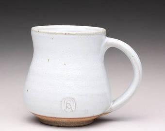handmade pottery mug, ceramic teacup, coffee cup with orange shino and white wood ash glazes