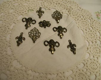 Vintage Decorative Hooks European Inspired Fleur de Lis (2) Filagree (2) Cherubs (3) Bows (2) Antique Brass Small 1" Tall Hooks Set of 9