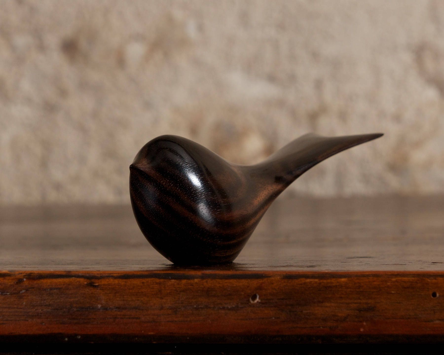 Small wooden black bird sculpture carved from macassar Small wooden black bird sculpture carved from macassar