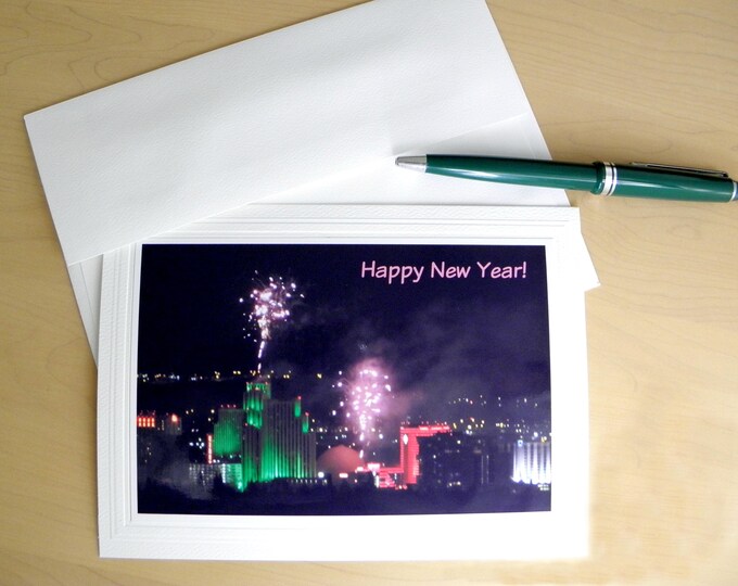 HAPPY NEW YEAR Photo Greeting Card featuring fireworks after dark over Reno, Nevada, plus coordinating envelope