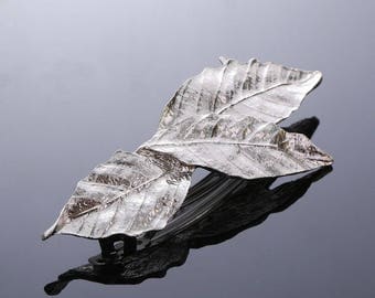 French Barrette three silver leaves in nice arrangement.