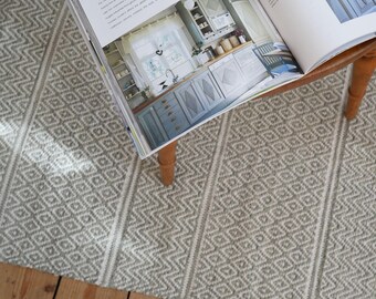 Light green patterned floor runner and large rug