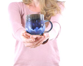 handmade rustic pottery mug. ceramic mug. handmade coffee cup. flowing deep blue glaze. handmade in ithaca. under the tree.