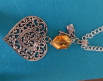 Large heart pendant on long silver chain