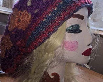 Gorgeous hand crocheted slouch hat in reds pinks and blues