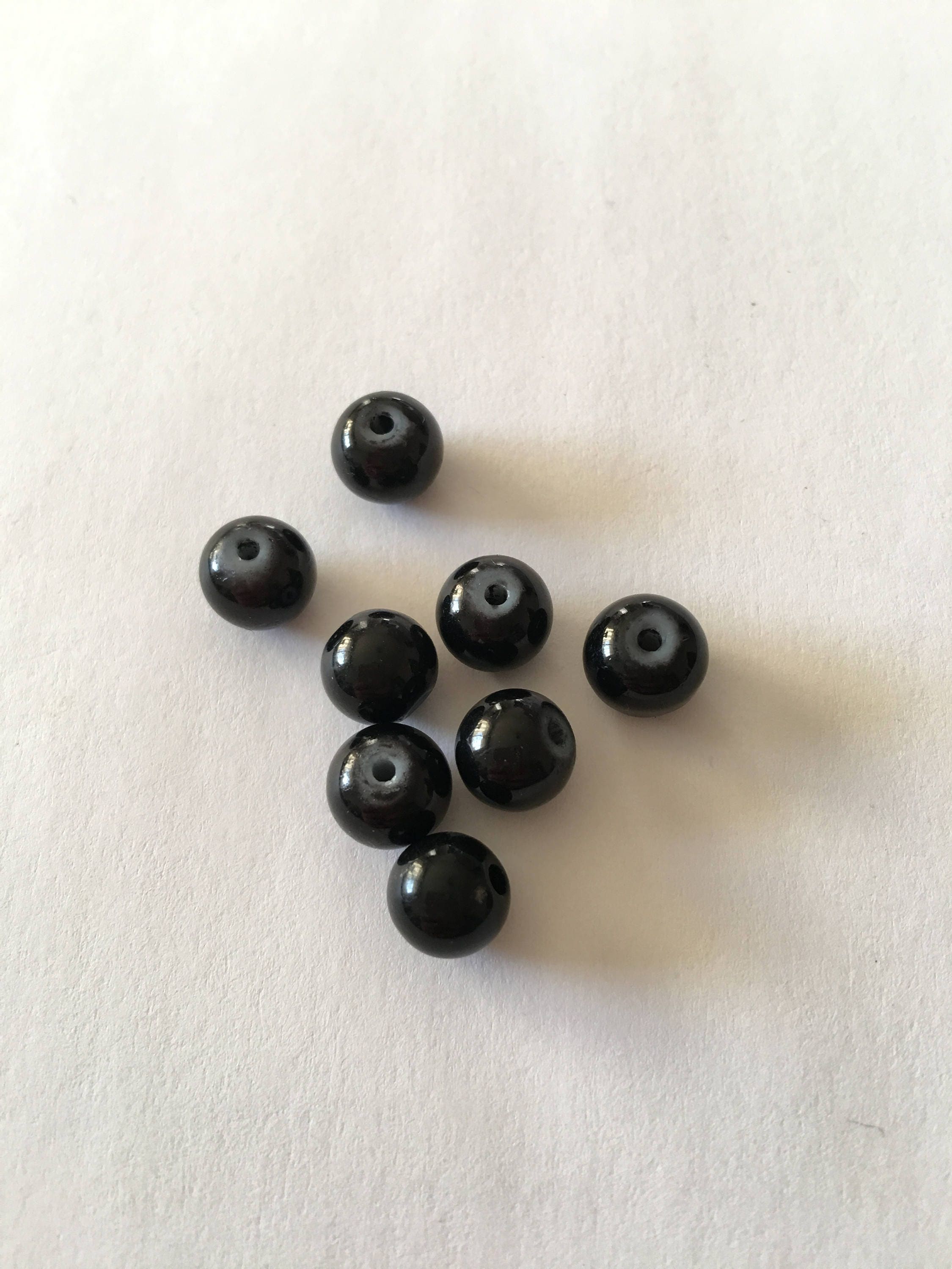 Set of 8 round black beads (Ref 101) from LaBoiteABijoo on Etsy Studio