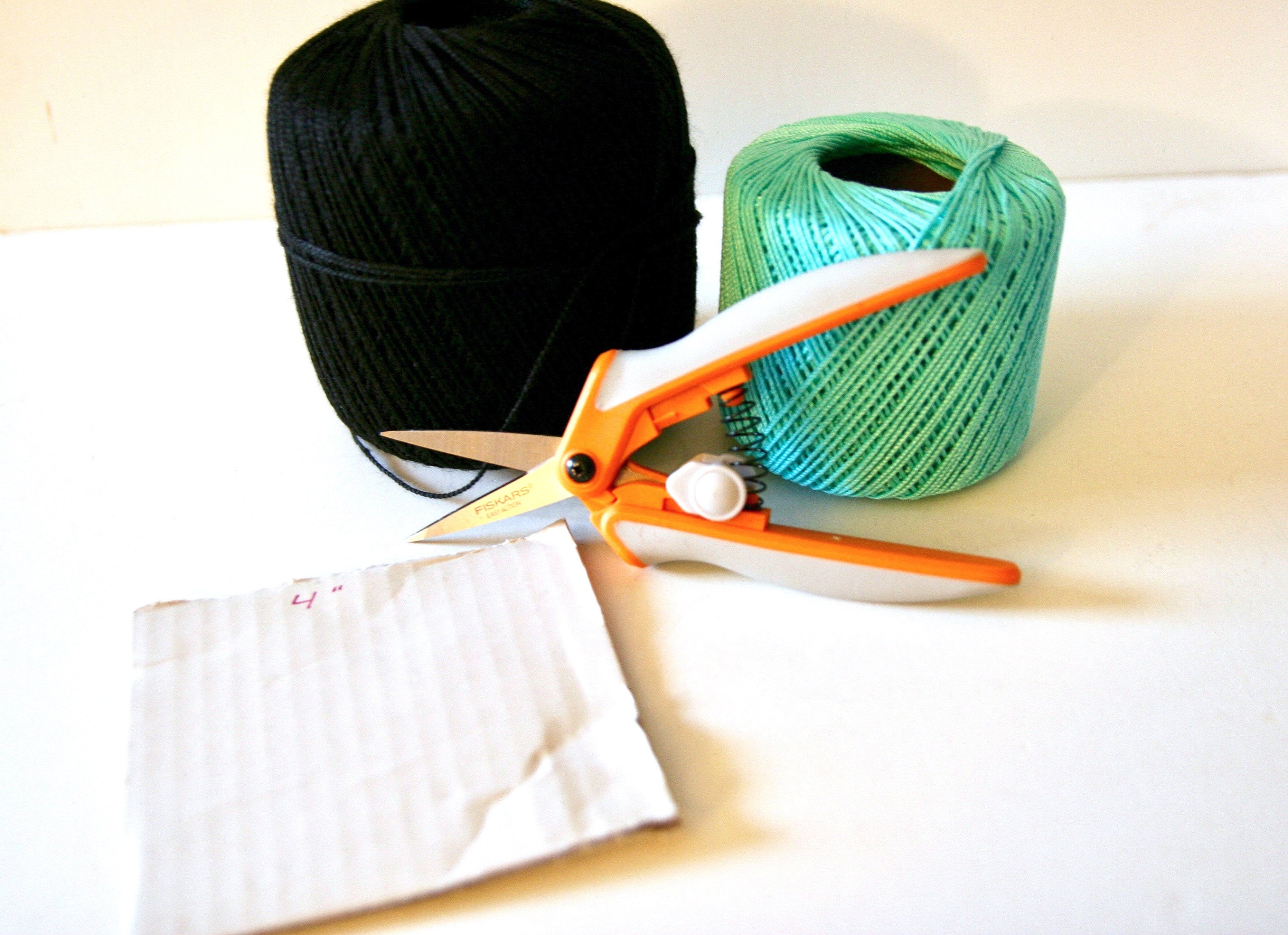 Materials: Crochet thread, fabric scissors, 4 inch piece of cardboard