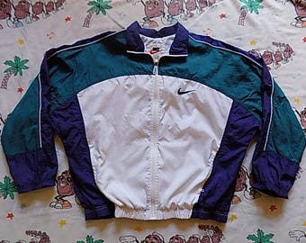 Vintage 90's Nike Windbreaker Jacket, size L/XL in white, teal, and blue color block Swoosh
