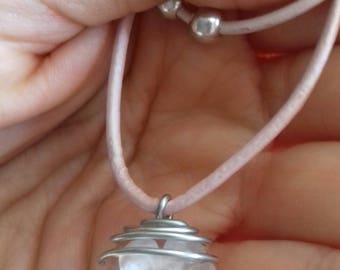 Pendant with natural flower inside transparent sphere
