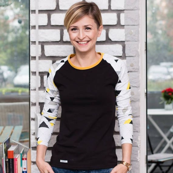 Lady's long sleeve black shirt with printed white yellow