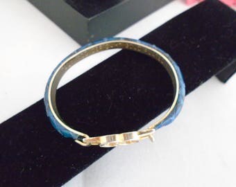 Vintage GUCCI 24 karat Gold Plated BLUE Snakeskin Leather Bracelet with Gucci Logo and a Bit of Tarnish due to age. Fits a size 7 wrist best
