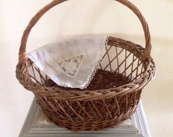 Round old wicker basket with crossed days, French baskets