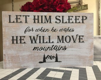 Let him sleep for when he wakes he will move mountains wood sign
