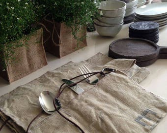 Set of 2 sturdy cutlery cases and 2 matching placemats by vintage postbags.